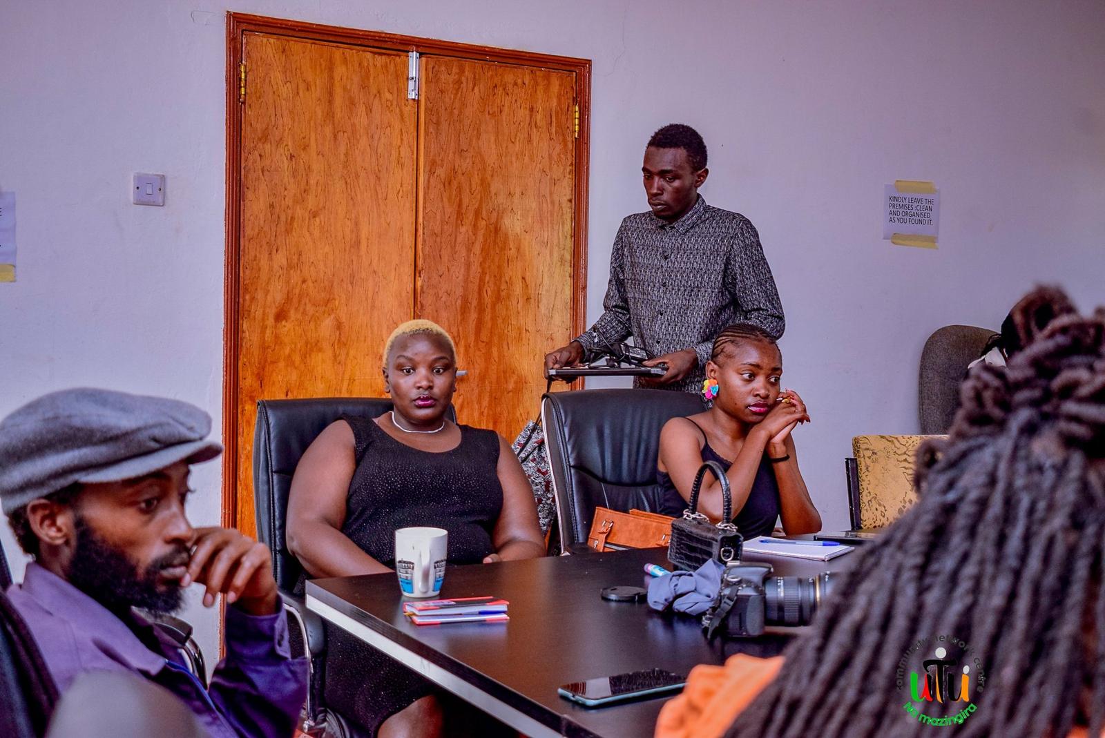Utu Heritage members seated around a boardroom table during the Utu na Mazingira launch session