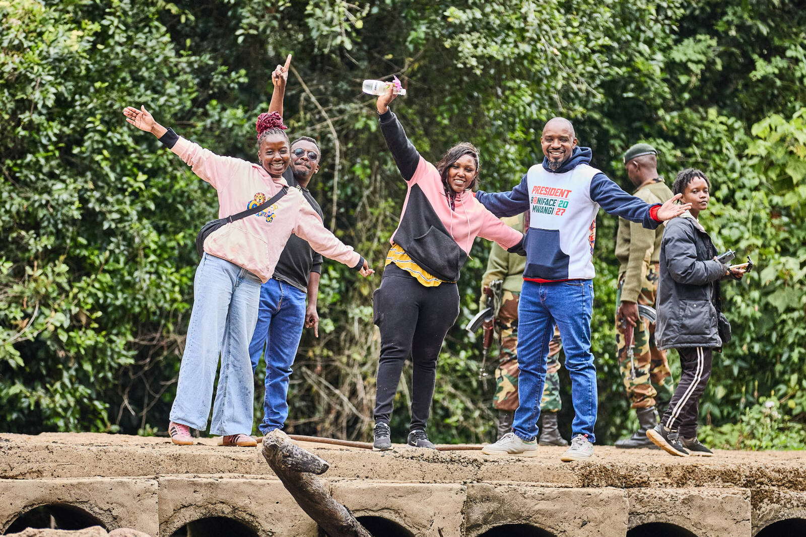 Community members with arms raised during a heritage walk